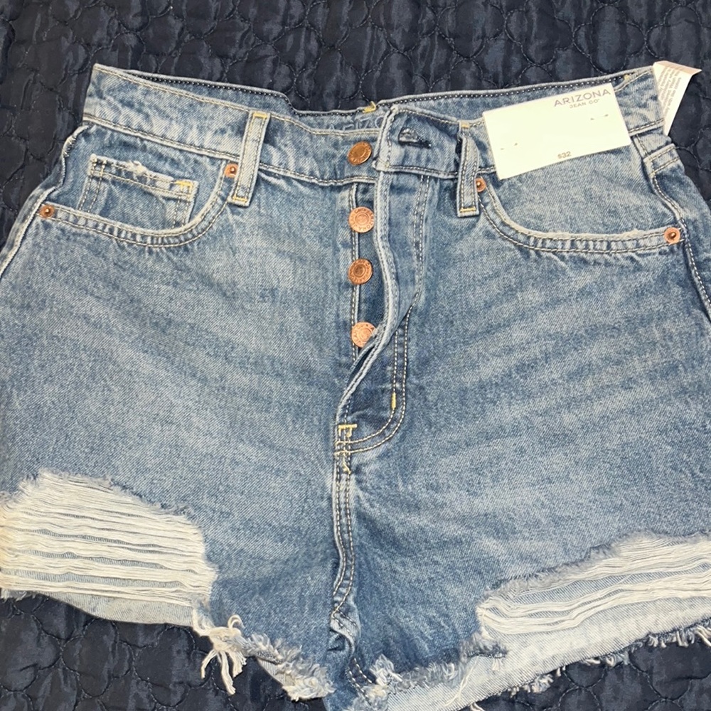 Brand new!!! Denim distressed jean shorts. Size 11!